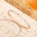 Minimalist rose gold stainless steel bangle with white shell inlays and sparkling crystals - Rose Gold