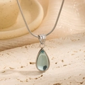 Elegant silver teardrop necklace with translucent teal stone on sleek snake chain - Blue Teardrop / Steel