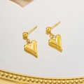 Vintage hip-hop gold heart pendant earrings with high-polish finish on mirror background - Heart Stud / Gold