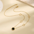 Golden titanium necklace with black flower pendant and hollow floral charms on chain - Single Sided Black Shell Flower Style (X017)