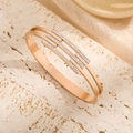 Elegant rose gold titanium steel open bangle with sparkling pavé stones and openwork design - Rose Gold