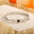 Polished silver titanium steel bangle with black shell center and sparkling zircons - Steel