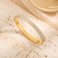 Elegant gold titanium steel bracelet with three rows of sparkling zircon stones - Four Row Rhinestone Style (Z618) / Gold