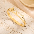 Golden double-layer butterfly bangle with sparkling pavé rhinestones and matte finish - Gold