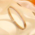 Set of three minimalist polished titanium steel bangles in gold, silver, and rose gold finishes - Plain Bangle (2231) / 55mm Diameter / Gold