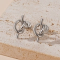 Minimalist silver knot earrings for women on stone background, elegant and artistic style - Knot Stud Earrings (E107) / Steel