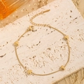 Elegant gold-plated heart bracelet set featuring four charms on a stainless steel chain - Gold Heart Anklet