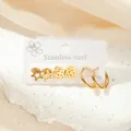 Ensemble de trois boucles d'oreilles dorées en acier inoxydable avec étoile et fleur - Ensemble Étoile Fleur Évidée (TYE0467)
