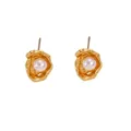 Detailed close-up of vintage golden baroque stud earrings with white pearl accents - Gold Earrings Only