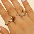 Close-up of bohemian gold rings set with brown tiger eye stones and white crystals - 波西米亚锤纹戒指套装(3个装) / Gold