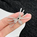Silver spider brooch with clear rhinestones and black center stone for Halloween decor - Rhinestone Black Gem Spider Style (K-1141)