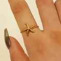 Detailed view of the 18K gold starfish ring featuring textured details and twisted band - Starfish Style (1686) / Gold
