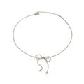 Elegant stainless steel silver bow necklace with snake chain and bead fringe on white background - Silver