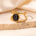 Detail of gold-plated asymmetric ring featuring oval grey cat's eye stone and beaded texture - Dark Gray (R0829)