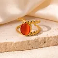 Macro detail of gold-plated double-layer ring featuring a vibrant orange oval gemstone - Orange Red (R0827)