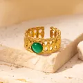 Macro detail of gold-plated woven ring with round green turquoise stone on stone surface - Braided Green Cat's Eye Adjustable Style (TYR0837)