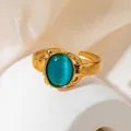 Bague ouverte dorée vintage avec une grande pierre œil-de-chat ovale verte élégante - Style Cabochon Ovale Œil de Chat Bleu Cyan (TYR0844)