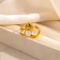 Detail of adjustable gold ring with white pearl and teardrop shape on fiber texture - Leaf Bud Design Artificial Pearl Style (R1211)