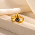 Detailed view of golden textured ring featuring a black onyx stone and water drop charm - Matte Texture Black Stone Style (R1210)