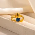 Detailed close-up of double-wrap gold ring with dark blue gemstone and drop-shaped element - Double Wrap Deep Blue Stone Style (R1215)