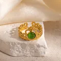 Detailed shot of golden crown ring with green cat eye stone and vintage heart filigree - Crown Design Green Cat's Eye Adjustable Style (TYR1347)
