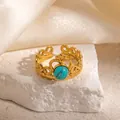 Detail of vintage gold crown ring with turquoise stone on white rock and silk - Crown Design Turquoise Adjustable Style (TYR1346)