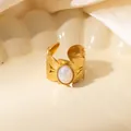 Macro shot of French style gold leaf ring featuring a central oval iridescent opal stone - Leaf Texture White Iridescent Stone Adjustable Style (TYR1498)