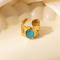 Detailed macro view of gold hollow leaf ring featuring a blue cat's eye gemstone - Leaf Texture Blue Cat's Eye Adjustable Style (TYR1502)