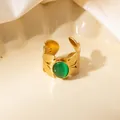 Close-up of vintage hollow leaf ring with green cat eye stone and gold finish - Leaf Texture Green Cat's Eye Adjustable Style (TYR1501)