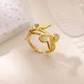 Detail of vintage golden leaf ring with pale green cat eye stones and adjustable band - Gold Cat Eye Stone Leaf Style (JZ8150G)