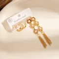 Ensemble de trois boucles d'oreilles en acier doré avec pompons fleur et perles blanches - Ensembles de boucles d'oreilles fleurs 0878