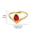 Macro shot of V-shaped gold ring featuring a teardrop red gemstone and beaded edges - Adjustable Open / Red Teardrop Stone Style (G127095G-1)
