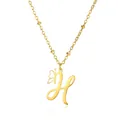 Macro view of gold stainless steel necklace with cursive letter H and butterfly charm detail - Letter H Style