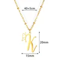 Close-up of gold stainless steel K-letter pendant necklace with butterfly wing design - Letter K Style