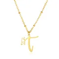 Close-up of golden necklace with butterfly charm and letter T pendant on chain - Letter T Style
