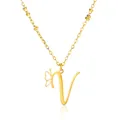 Macro shot of gold V pendant necklace with cutout butterfly and beaded chain detail - Style Letter V