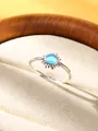 Silver open ring featuring a round blue moonstone inlay with sunburst pattern details - Sunflower Blue Cat Eye Stone Style (JZ814S-T)