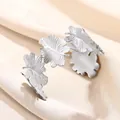 Macro detail of silver leaf texture on a wide stainless steel open cuff bracelet - Ginkgo Leaf Shape Style (B1495P)