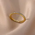 18K gold plated adjustable open ring featuring micro-paved blue round zircon stones - Gold Band With Blue Zirconia Style (JZ4042G-2)
