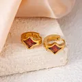 Golden titanium steel hoop earrings featuring square red cubic zirconia stones - Red Rhombus Style (1408)
