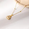 Gold stainless steel necklace with cream handbag pendant and bowknot detail - White Style (0535)