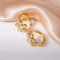 Golden flower hoop earrings with transparent zircons on elegant champagne silk backdrop - White Five-Petal Flower Style (1338)