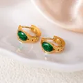 Elegant gold titanium steel hoop earrings with large green faceted oval gemstones - Green Oval Eye Style (1421)