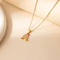 Golden stainless steel letter A necklace with festive Christmas hat and gingerbread details - Santa Letter A