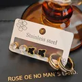 Parure de boucles d'oreilles en acier inoxydable avec nœud et trèfle en zircons - Style Papillon Noir Semi-Diamant (EXRGE1010)
