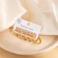 Three pairs of golden stainless steel hoop earrings set with zirconia on silk fabric - Mirror and Rhinestone Hoop Earring Set (EXRGE1720)