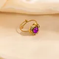 Golden flower ring featuring a faceted purple gemstone and sparkling white crystals - Purple Geometric Style (1661)