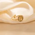 Golden Tree of Life open ring with sparkling cubic zirconia on cream silk background - Tree of Life Style (1660)