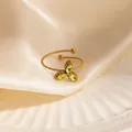 Adjustable gold twist ring with olive green marquise leaf stones on silk background - Yellow Clover Style (1638)