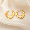 Luxe chunky gold twisted hoop earrings with irregular texture on satin background - Textured Heart Earrings 0167